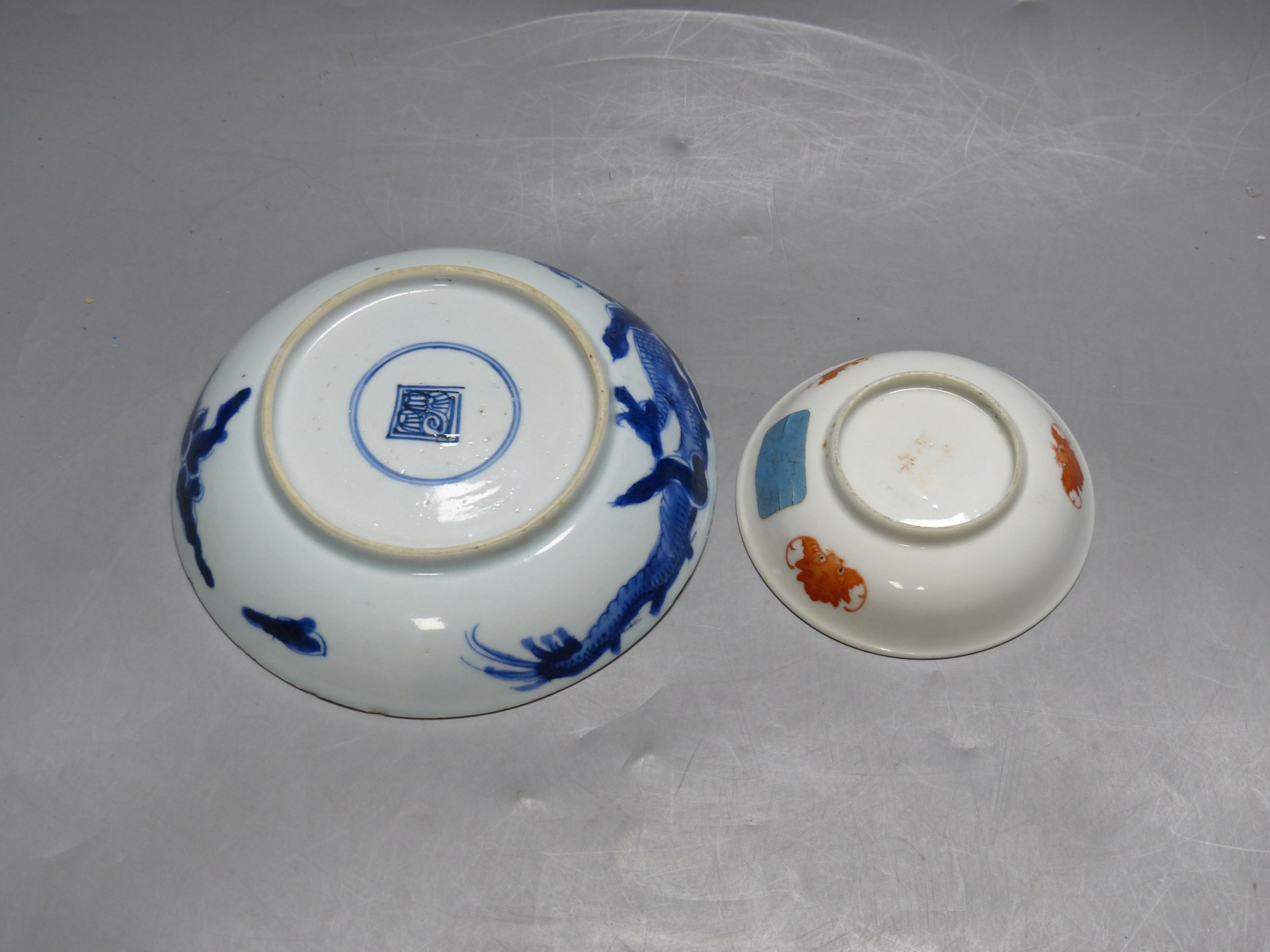 A Chinese blue and white dish, diameter 15.5cm, and smaller enamelled dish